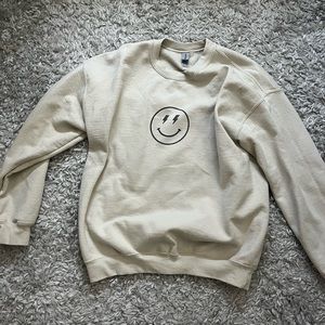 Tan (size large) preppy smiley faced crewneck. Amazing condition lightly worn.
